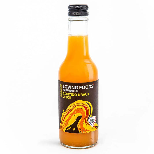 Bottle of Loving Foods Organic Cortido Kraut Juice, a fermented vegetable juice in a clear glass bottle with a label.