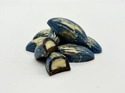 Close-up of Gorvett & Stone Brandy Pods, loose herbal tea pods in a natural setting with vibrant plant details.