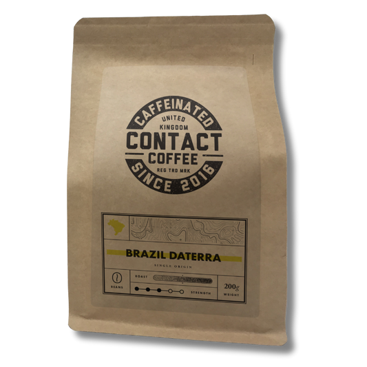 Single Origin Brazil Daterra coffee beans from Contact Coffee Company Ltd. displayed in a clear image of roasted beans.