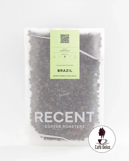 Brazilian Eagle Monte Carmelo medium roast coffee bag from Recent Beans, with a sleek design and fresh coffee beans visible.