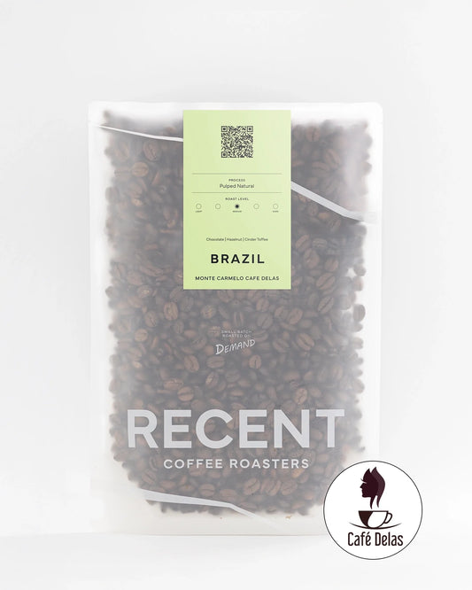 Brazilian Eagle Monte Carmelo medium roast coffee bag from Recent Beans, with a sleek design and fresh coffee beans visible.