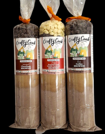 Assorted brown puddings from Crafty Cook's Pudding Heaven collection, displayed together in a group shot.