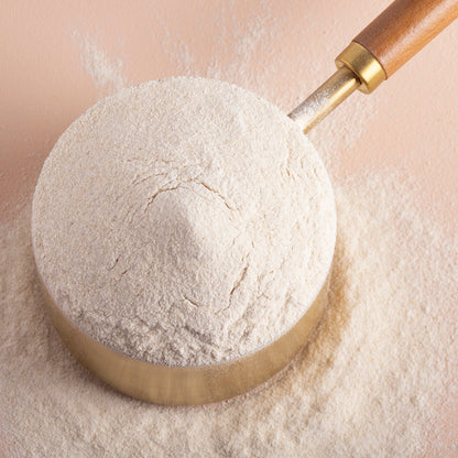 Organic cassava flour from Whole Food Earth in a clear bag, showing fine, white, powdery cassava flour on a neutral background.