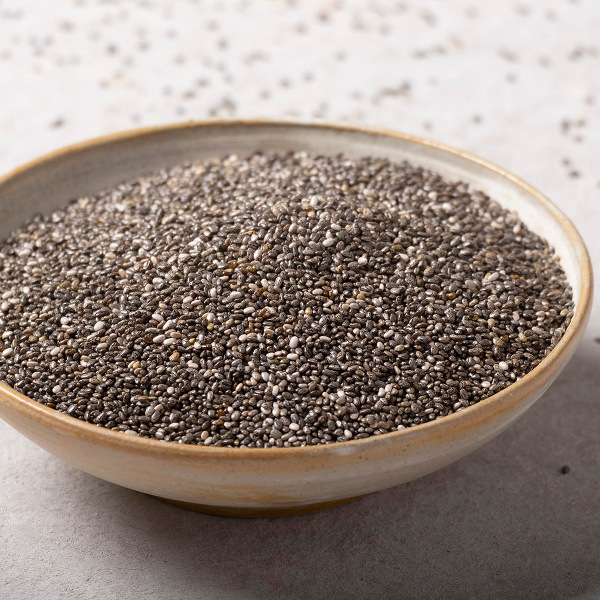 Whole Food Earth chia seeds, small dark seeds for healthy eating, shown in a close-up of the nuts and seeds product image.