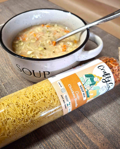 All-purpose chicken noodle soup mix by Crafty Cook, featuring dried noodles and seasoned chicken broth in a clear package.