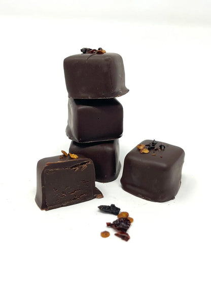 Stack of Gorvett & Stone chipotle chili chocolates showing dark chocolate squares with chili flavor visible.