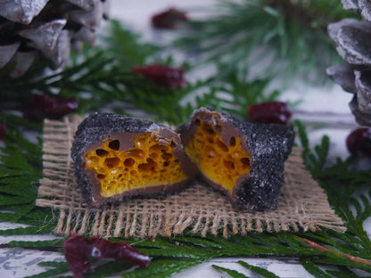 Limited edition handmade Christmas coal made of cinder toffee and honeycomb by Gorvett & Stone, shown as black coal chunks.
