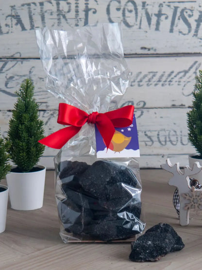Limited edition Gorvett & Stone handmade Christmas coal made of cinder toffee and honeycomb, displayed in a festive setting.