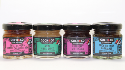 Assorted sweet and savory chili food items in a gift set from Goch & Co, displayed in festive packaging.