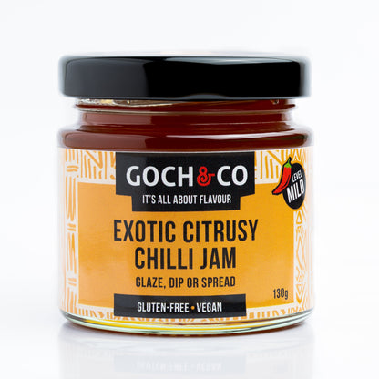 Jar of Goch & Co Exotic Citrusy Chilli Jam showing the label and vibrant orange-red jam inside.