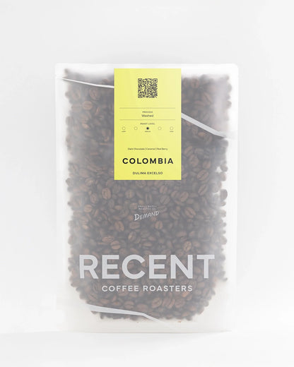 Dulima Excelso medium roast coffee beans from Recent Beans, showcasing freshly roasted coffee with a rich, aromatic appearance.