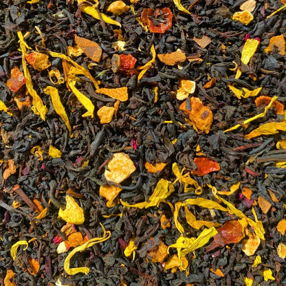 Black Pumpkin Spice Tea by Porter Hill Tea Company in a clear glass cup, showcasing the rich dark tea with pumpkin spice aroma.
