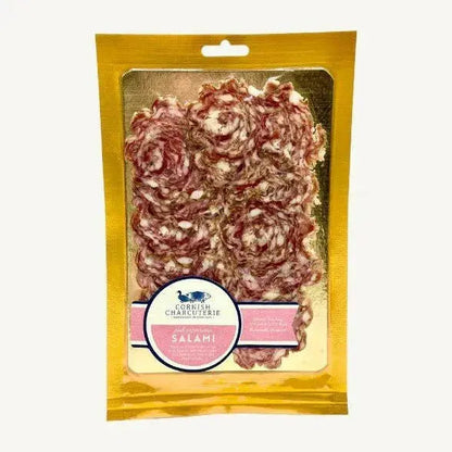 Slices of Cornish Charcuterie Pink Peppercorn Salami from ArtisanBox Selection, showcasing pink peppercorns on thinly sliced salami.