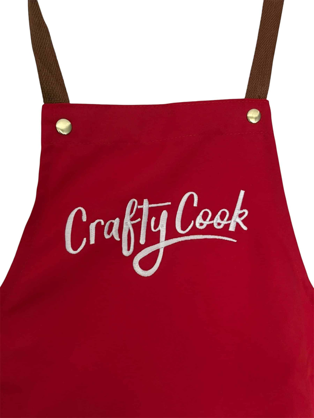 Crafty Cook apron with logo, featuring front pockets, ideal for cooking and baking, made of durable fabric.