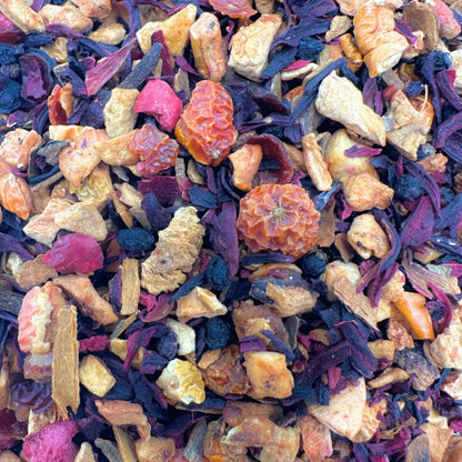 Porter Hill Tea Company Cranberry Apple Tart Fruit & Herbal tea in a teacup, showcasing bright red cranberries and apple slices.