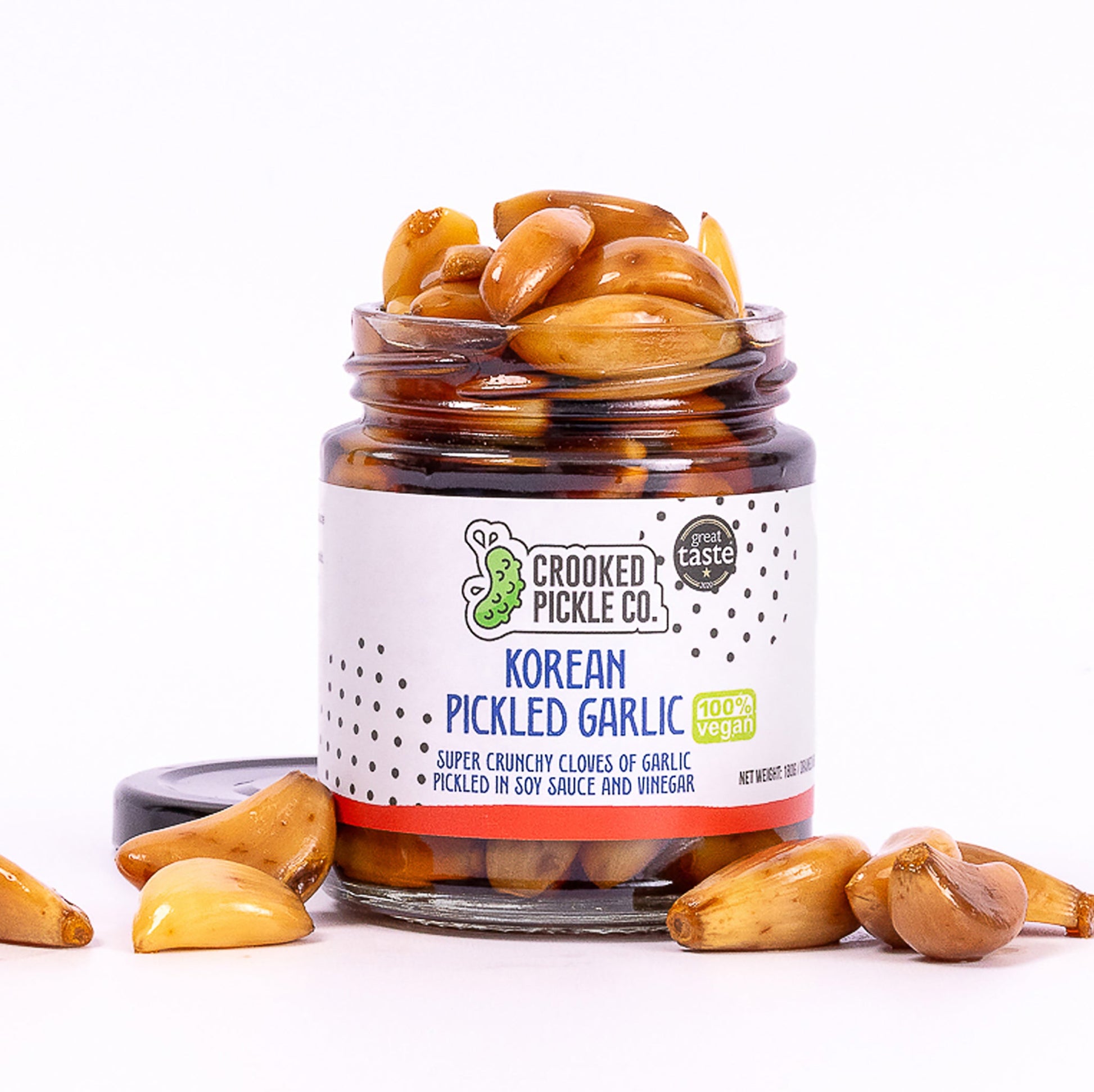 Jar of Crooked Pickle Co Korean Pickled Garlic with Great Taste Award logo.