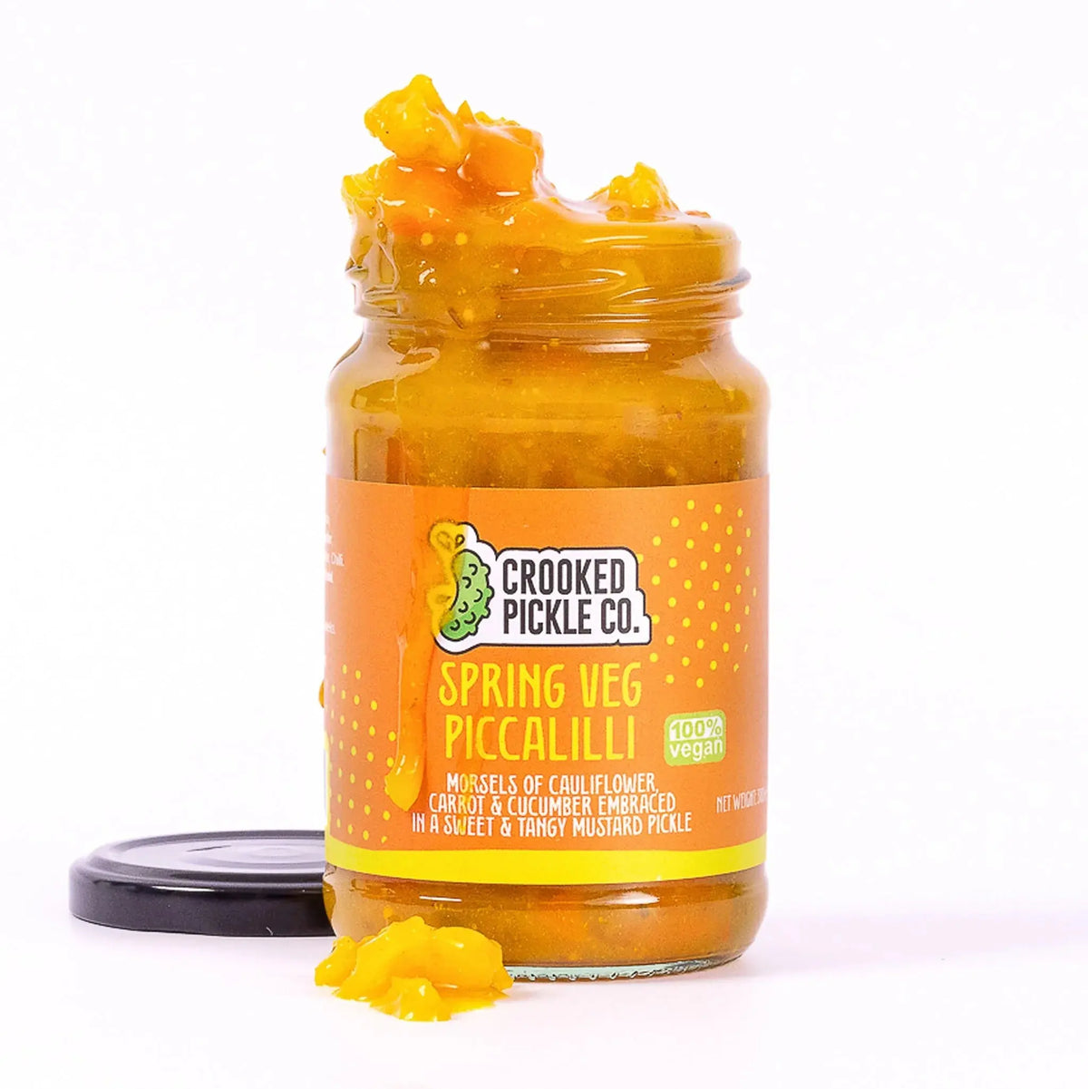 Jar of Crooked Pickle Co. Spring Veg Piccalilli with colorful mixed vegetables in a tangy, yellow mustard-based sauce.