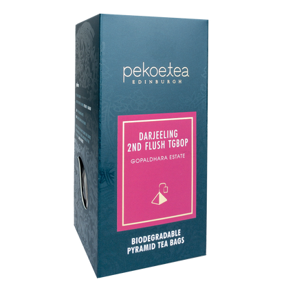 PekoeTea Edinburgh Gopaldhara TGBOP Second Flush Darjeeling tea leaves in a jar, showcasing the high-quality tea for brewing.
