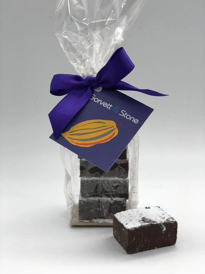 Gorvett & Stone dark chocolate orange meltaways showing glossy dark chocolate coating and orange-flavored filling inside.