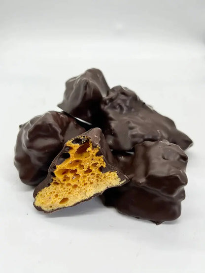 Dark chocolate cinder toffee with honeycomb pieces, handmade by Gorvett & Stone in a 250g package.