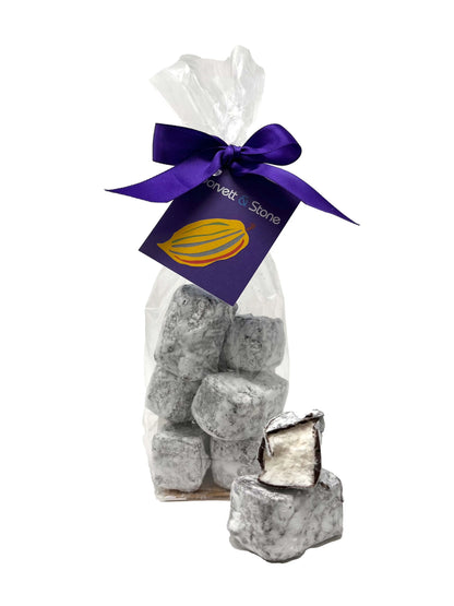 Gorvett & Stone honey and vanilla marshmallow in dark chocolate coating in a bag, showcasing the sweet treat inside.