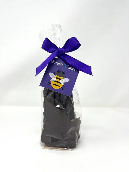 Packaged 70% dark chocolate honeycomb shards from Gorvett & Stone, showing irregularly shaped chocolate pieces with honeycomb texture.