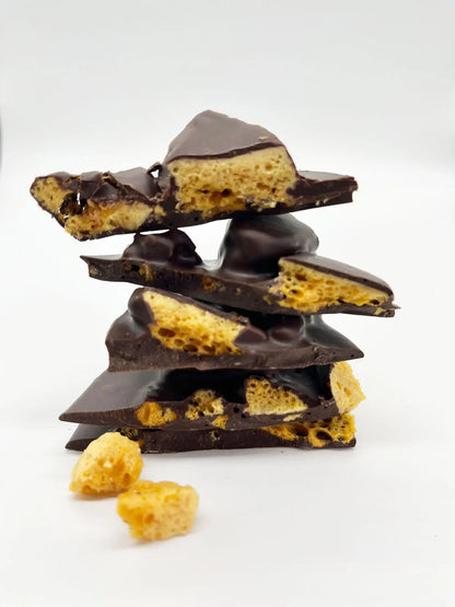 Stack of Gorvett & Stone 70% dark chocolate honeycomb shards with a rich, crunchy texture and deep chocolate color.