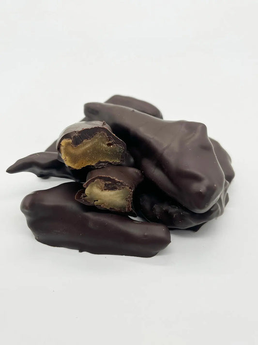 Dark chocolate-covered pear from Gorvett & Stone, showcasing a glossy chocolate coating on a fresh pear.