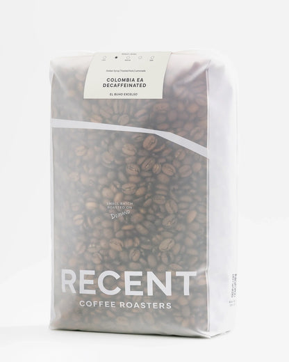 Decaf El Buho Excelso medium roast coffee beans from Recent Beans in a 1kg bag, showcasing the coffee beans in close-up.