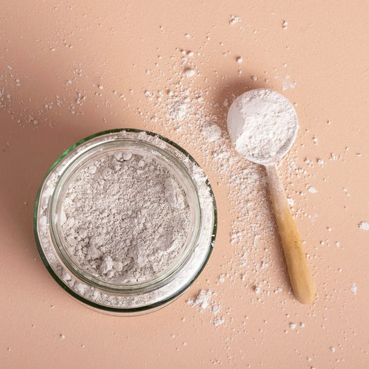 Food grade diatomaceous earth mineral from Whole Food Earth, showing fine white powder used for health and gardening purposes.