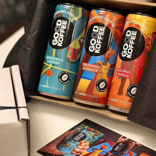 Three cans of GOOD KOFFEE Sparkling Coffee in a Discovery Taster Box, showcasing the colorful packaging and branding.
