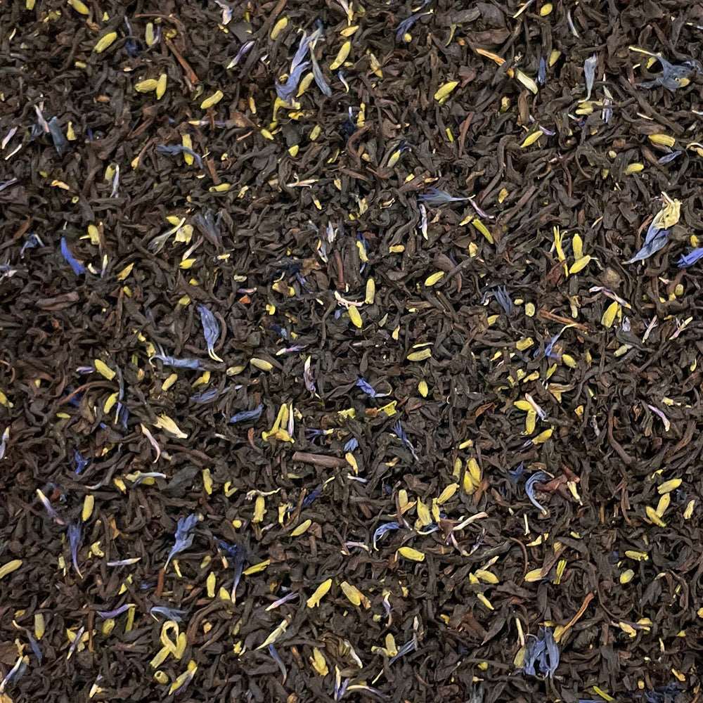 Loose leaf Earl Grey Reserve tea with cornflowers from High Teas, showing a blend of gray tea leaves and vibrant blue cornflowers.