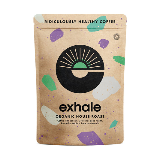 Organic house roast coffee by Exhale Healthy Coffee in a white background, showing a bag of freshly roasted coffee beans.