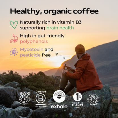Organic decaf coffee from Exhale Healthy Coffee, showing a bag of the coffee with a steaming cup on a wooden table.
