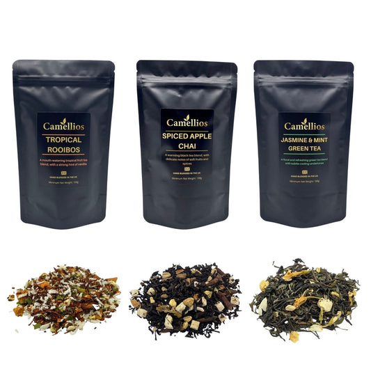 Assorted exotic loose leaf teas and infusions in a bundle from Camellios, displayed with various colorful tea leaves and herbs.