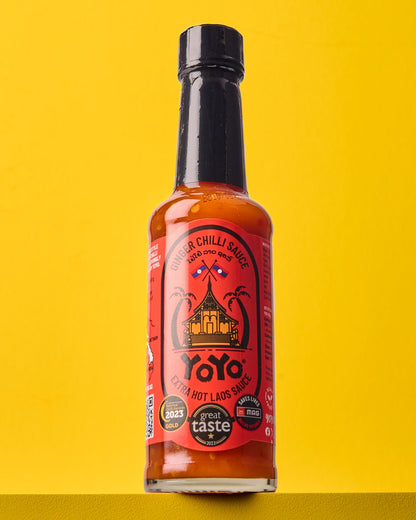 Spicy extra hot ginger chili sauce in a jar by YoYo Laos Sauce, showcasing vibrant red chili and fresh ginger pieces.