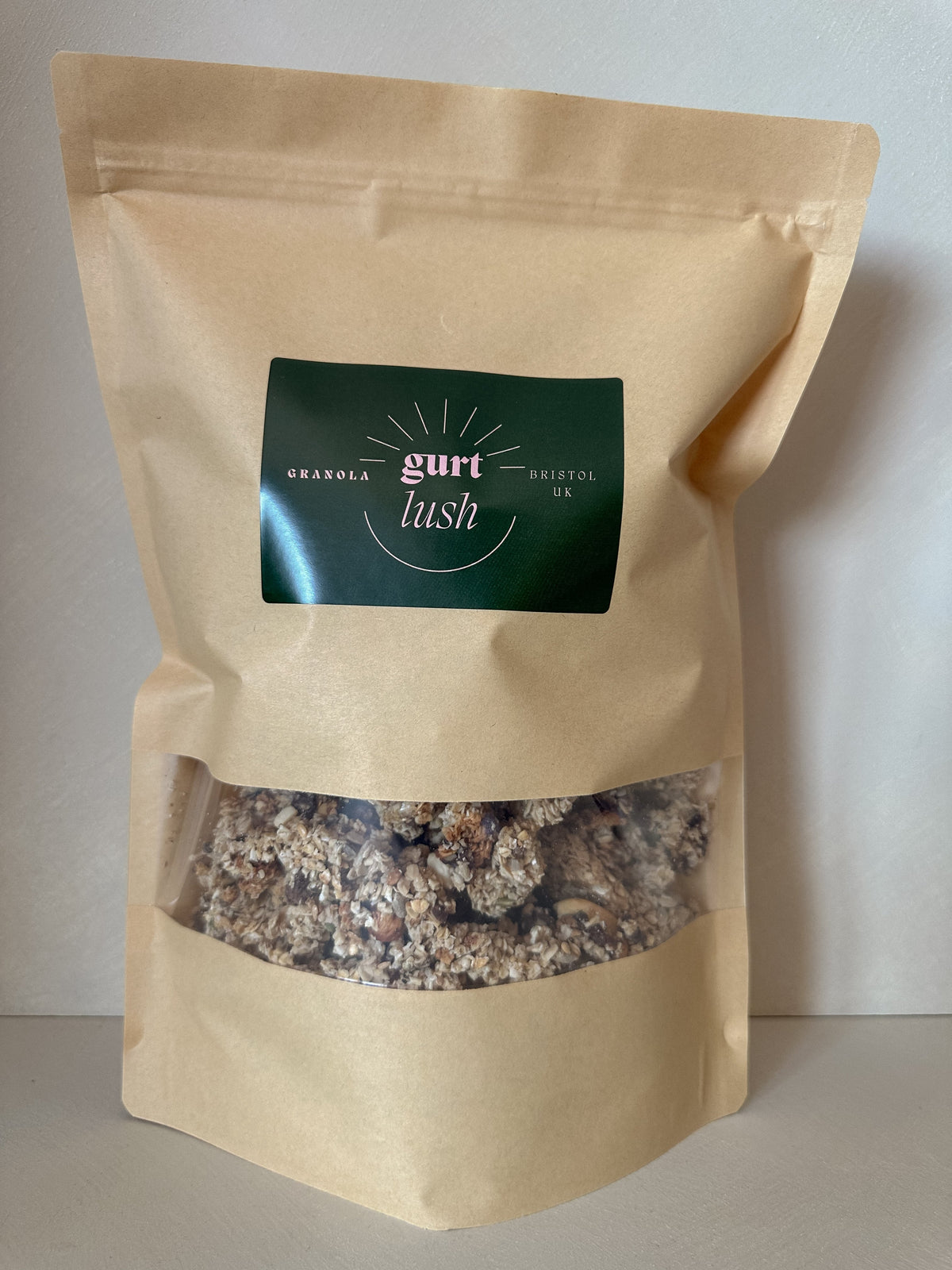 Dark chocolate, nut, and seed granola from Gurt Lush Food Co, shown in a close-up with clusters of crunchy granola.