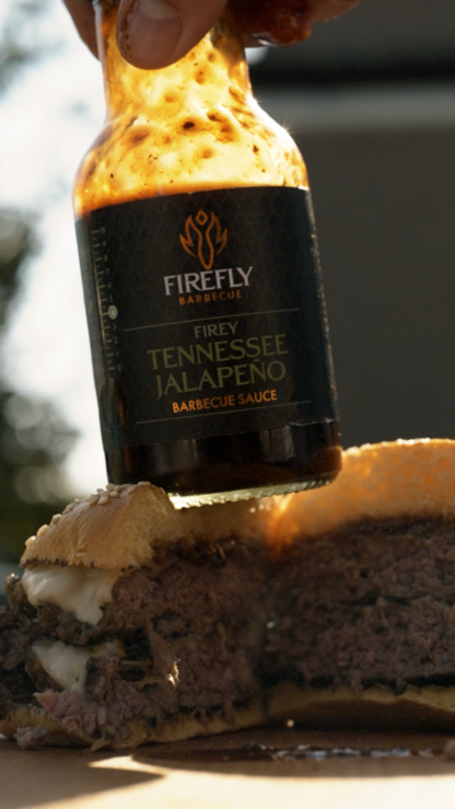 FireFly Barbecue Tennessee Jalapeño BBQ Sauce in a bottle, featuring vibrant label design and spicy jalapeño flavor.