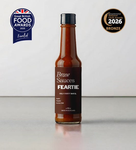 Braw Sauces Feartie Hot Sauce bottle with vibrant label, showcasing fiery chili peppers and bold branding on the product.