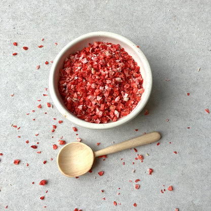 Freeze dried strawberry crumbs from Whole Food Earth, showing vibrant red dried fruit pieces with a crunchy texture.