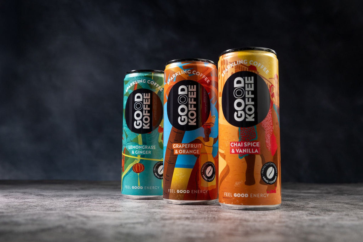 Close-up of all three flavours of GOOD KOFFEE sparkling coffee cans on a dark background