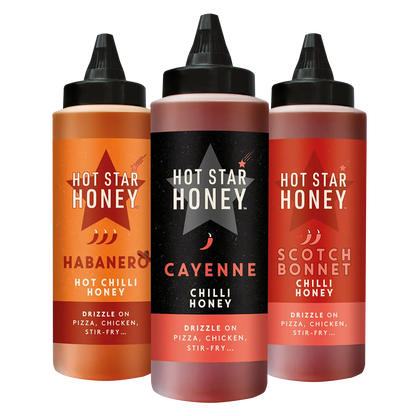 Set of three Hot Star Honey chilli honey jars with vibrant labels, showcasing spicy and sweet honey blends for culinary use.