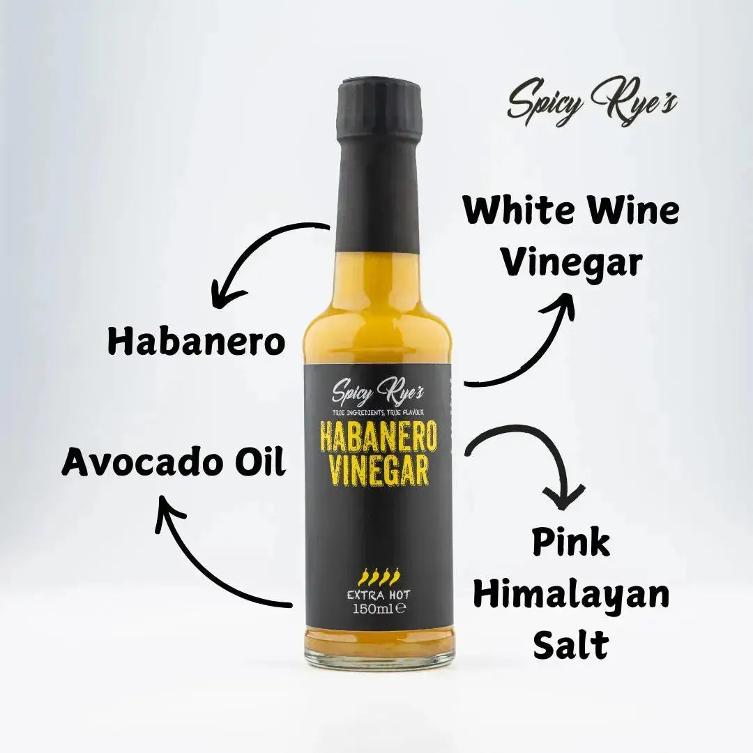 Spicy Ryes Habanero Vinegar bottle with vibrant orange label and fiery peppers, ready for culinary use.