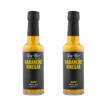 Two bottles of Spicy Ryes Habanero Vinegar with bright orange habanero peppers on the labels.