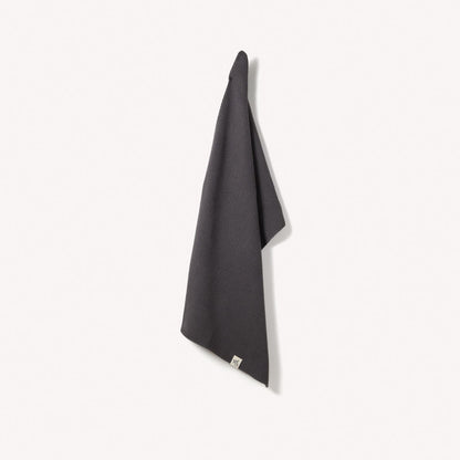 Organic cotton hand towel from Wild and Stone, soft and absorbent with a woven texture in natural neutral tones.