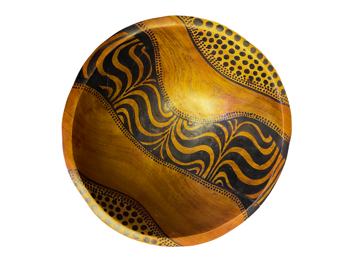 Hand-carved African wooden bowl by Goch & Co showcasing intricate tribal patterns and smooth polished finish.