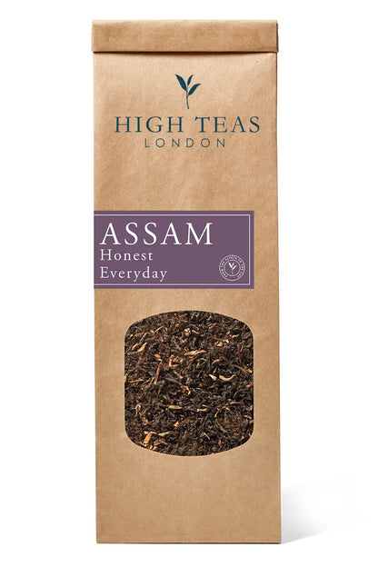 Loose leaf Honest Everyday Assam OP1 tea by High Teas, showing bright orange pekoe tea leaves in a clear jar.