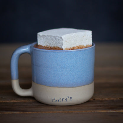 A square image of Harry's Hot Chocolate 60% hot chocolate package with rich, dark hot chocolate powder visible.