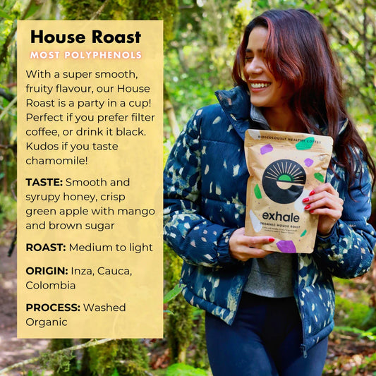 Organic House Roast Coffee from Exhale Healthy Coffee in a brewing scene with roasted coffee beans and a coffee cup.