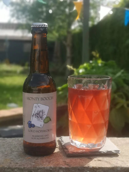 Monty Booch Lord Hopsworth Hopped Blueberry Kombucha bottles, 12-pack of 330ml bottles with vibrant blueberry and hop flavor.